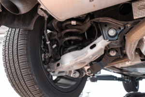 Car maintenance, auto repair in Englewood, CO by Autovisions. Image of a vehicle’s suspension system, including coil springs, control arms, and components, highlighting precise diagnostics, improved ride quality, and safe, stable driving performance.